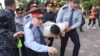 KAZAKHSTAN -- Law enforcement officers detain a man during an opposition rally held by critics of Kazakh President Kassym-Jomart Tokayev, who protest over his election in Almaty, Kazakhstan June 12, 2019.