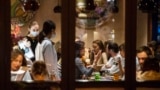 RUSSIA -- Customers sit in a restaurant at Patriarshiye Prudy, a hip restaurant and bar district in Moscow, October 16, 2020